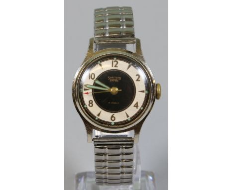 A Smiths Empire bracelet manual wristwatch with black and silvered dial illuminated fingers and second sweep finger.