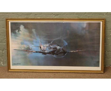 A framed print of a Vickers Supermarine spitfire MK VB of 243 squadron by Barrie A. F. Clark.