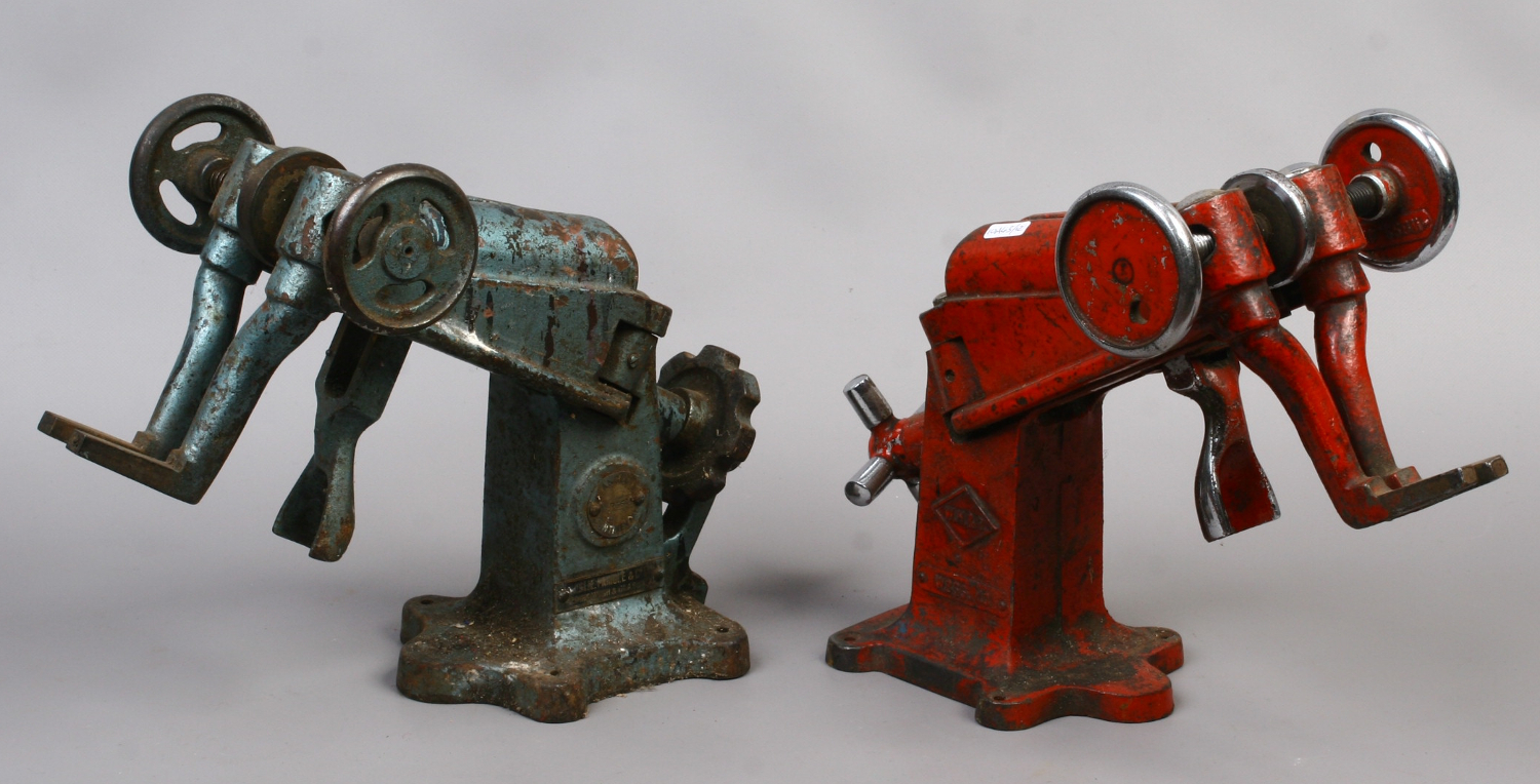 Two vintage cast iron cobblers shoe stretchers, one marked