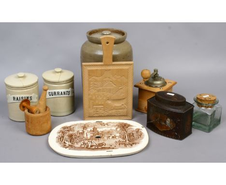 A quantity of vintage kitchenalia to include C19th drainer, stoneware storage jars, coffee grinder, tin tea caddy etc.