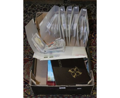 A box containing loose stamps, stamps in albums and first day covers.