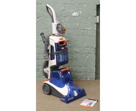 A Vax dual V advance carpet and upholstery cleaner with instructions.