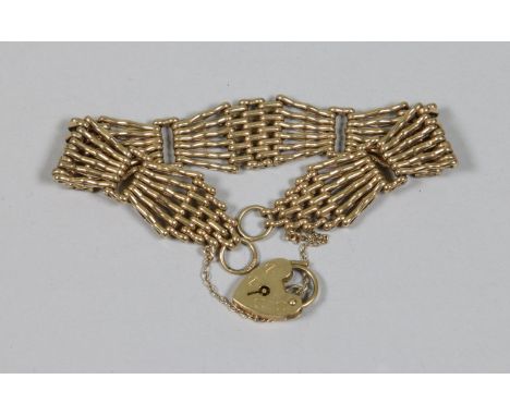 A 9ct gold gate bracelet with heart clasp, weight 24 grams.