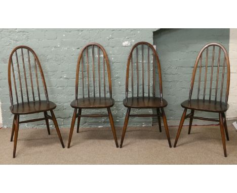 A set of four Ercol spindle back dining chairs.