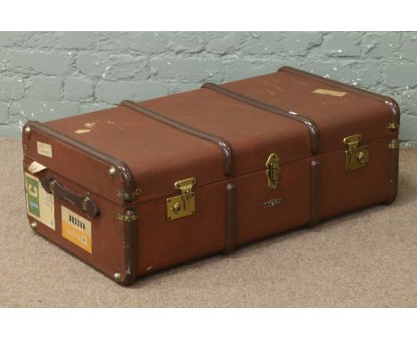 A vintage bound travel trunk.