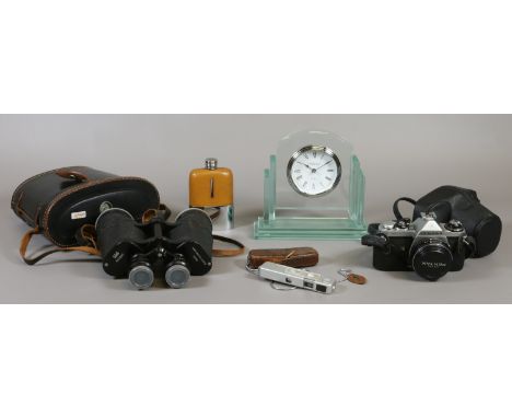 A pair of binoculars with a compass in the case Regent 10 x 50, a Pentax ME camera, German Minox spy camera, hip flask and a 