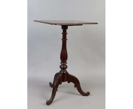 A Victorian carved and turned mahogany tripod table.