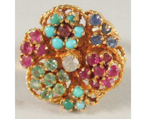 AN 18 CT GOLD TURQUOISE, RUBY, EMERALD, SAPPHIRE AND DIAMOND RING.