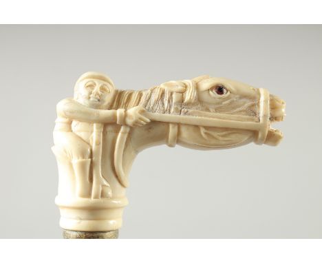 A WALKING STICK with carved bone handle. "HORSE &amp; JOCKEY"