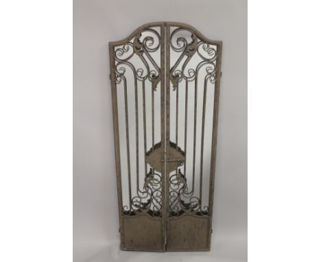 AN IRON FOLDING GATE MIRROR 48ins high.