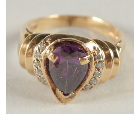 A 14CT GOLD AMETHYST AND DIAMOND RING.