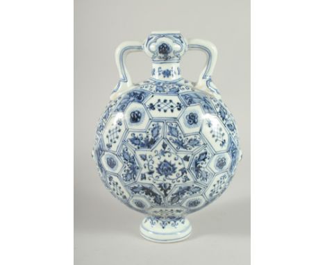A CHINESE BLUE AND WHITE PORCELAIN  TWIN HANDLED MOON FLASK. 28ins high.