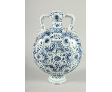 A CHINESE BLUE AND WHITE PORCELAIN  TWIN HANDLED MOON FLASK. 28ins high.