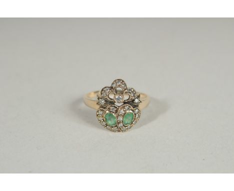 A 9CT GOLD EMERALD AND DIAMOND SWEETHEART RING.