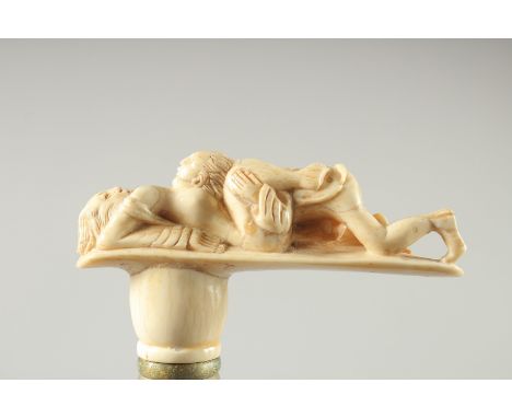 A WALKING STICK with carved bone handle. "EROTIC"