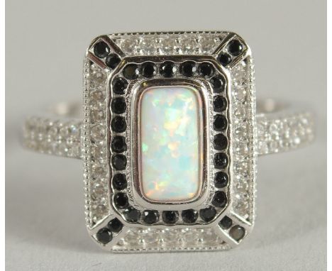 A SILVER ART DECO STYLE OPAL OCTAGONAL RING.