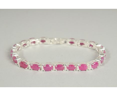 A SILVER RUBY SET LINE BRACELET.