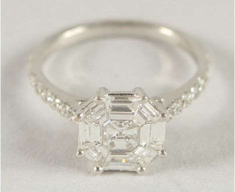 AN 18CT WHITE GOLD ASSCHER CUT DIAMOND CLUSTER RING.