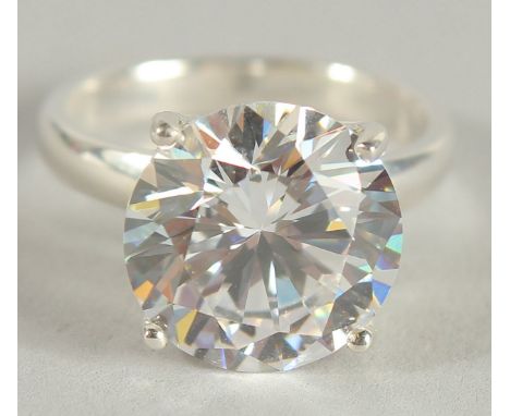 A SILVER ZIRCONIA SOLITAIRE RING.