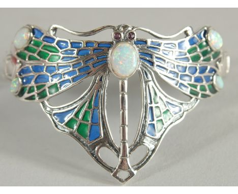 A SILVER PLIQUE A JOUR OPAL AND EMERALD DRAGON FLY BANGLE.