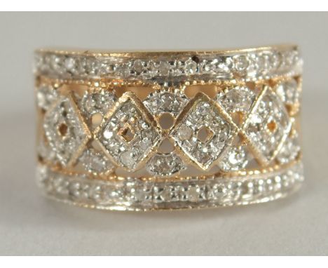 A 9CT GOLD DIAMOND SET WIDE RING.