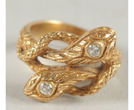 A 14CT GOLD AND DIAMOND DOUBLE HEADED SNAKE RING.