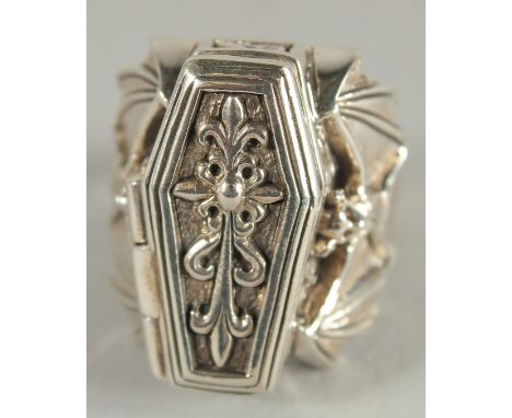 A SILVER COFFIN AND BAT SET RING.