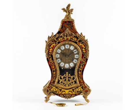 A mantle cartel clock, mounted with bronze in Napoleon 3 style, circa 1970.Copper marquetry&nbsp;inlay and probably imitation