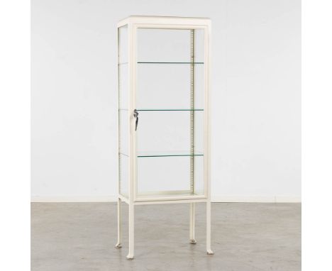 A white-patinated medicinal or doctor's cabinet. Finished with glass shelves.&nbsp;The first half of the 20th century.&nbsp;C