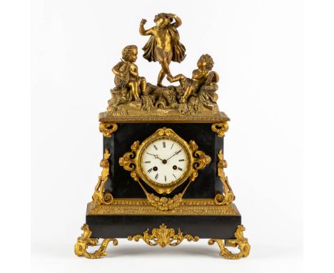 A mantle clock with dancing and musical Putti, Marble and bronze in Louis Philippe style.Napoleon 3 period, the second half o