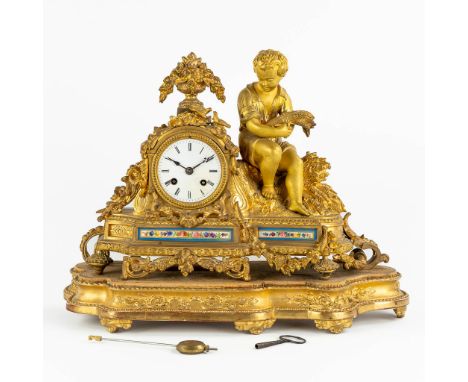 A mantle clock, gilt bronze finished with Sèvres porcelain plaques, 19th C.Dimensions: (L:16 x W:45 x H:35 cm)