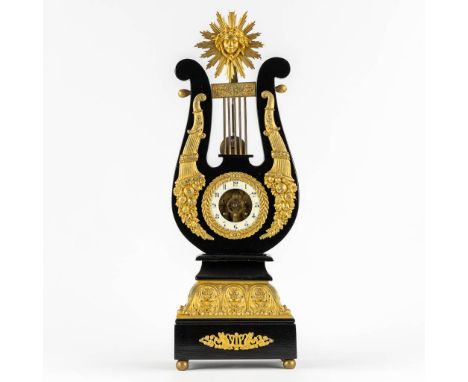 A Lyre mantle clock, gilt bronze and marble. 19th century.&nbsp;Movement signed Japy Frères.&nbsp;The second half of the 19th