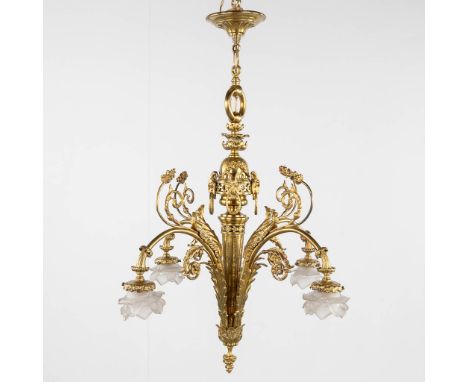 A Chandelier, bronze finished with ram's heads, Louis XVI style.Dimensions: (H:93 x D:66 cm)