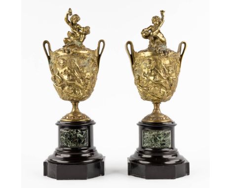 A pair of cassolettes, bronze on marble decorated with putti and Bacchus. Circa 1900.&nbsp;Dimensions: (L:16 x W:16 x H:44 cm