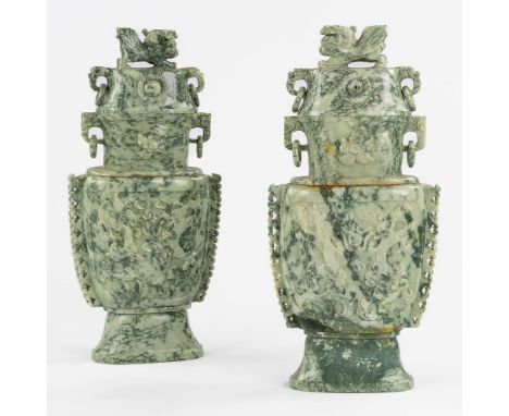 A Chinese pair of Jade sculptured vases with Foo Lion finials, 20th C.Dimensions: (L:16 x W:34 x H:74 cm)