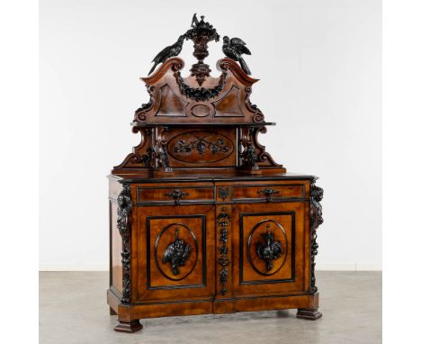 An impressive 'Saint Hubert' hunting cabinet with fine wood sculptures, dated 1871.Ebonised wood and rosewood veneer. Sculptu