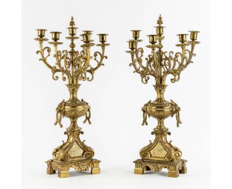 A decorative pair of candelabra, gilt bronze.&nbsp;Dimensions: (L:20 x W:26 x H:61 cm)