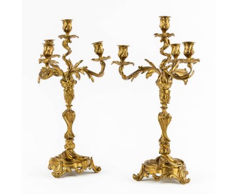 A pair of candelabra, bronze in Louis XV style. Circa 1900.Dimensions: (H:54 x D:27 cm)