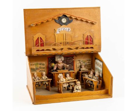 An antique lectern with a miniature diorama of a school, Probably from Germany, in the First half of the 20th C.8 small dolls