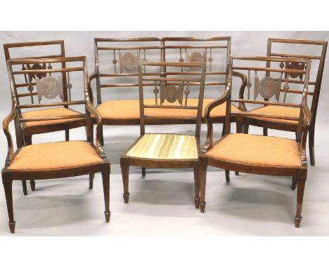 An Edwardian mahogany and marquetry salon suite, comprising two seat sofa, a pair of open armchairs, four side chairs and a p