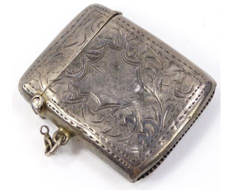A George V silver vesta case, of rounded outline, partially engine turned with a hook side and match strike base, Birmingham 