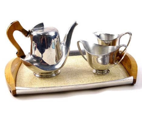 A Picquot ware aluminum and beech part tea service, comprising of a teapot, milk jug, two handled sugar bowl and a tray.