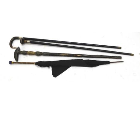 Walking sticks and umbrellas, umbrella with bamboo style handle and porcelain knop with black material end, 89cm wide, horn w