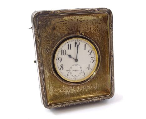 An Edwardian silver mounted watch case, containing a Goliath silver plated pocket watch, with white enamel dial.