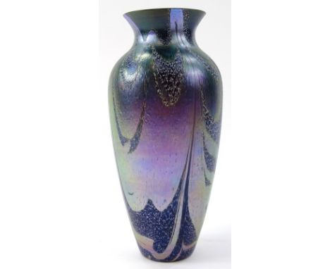 A 20thC iridescent Ditchfield style glass vase, of shouldered outline, decorated with a swirl floral pattern on a purple grou