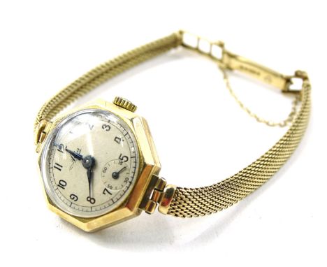 A 1950's 9ct gold Avia ladies wristlet/wristwatch, with octagonal dial, having Arabic numerals surrounded by minute track wit
