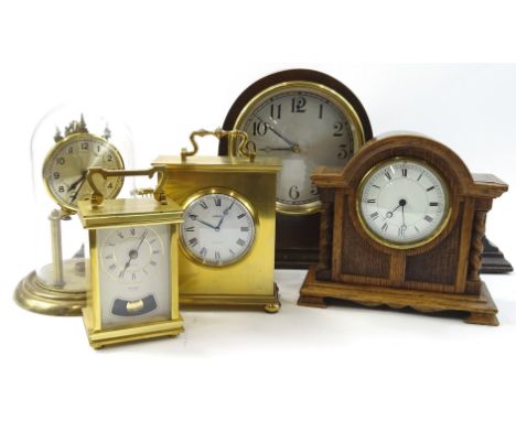 Various mantel clocks, to include an early 20thC oak cased example, Roman numeric and part Arabic dial, flanked by barley twi