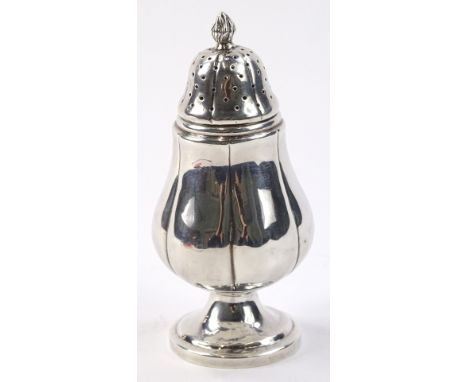 An early 20thC silver pounce pot, the bulbous body with compressed pierced lid and flame finial on circular foot, marked rubb