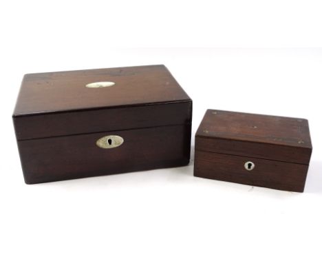 A 19thC rosewood jewellery box, of rectangular outline with mother of pearl style inlay to the centre, with part fitted inter