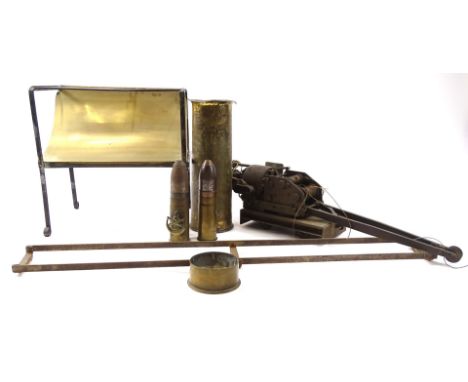 An unusual electric scale model of a crane, made in brass with a steel motor, incomplete, (AF), and a brass and iron trivet.